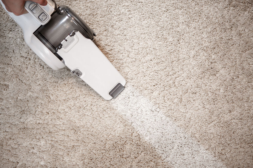 63296408 - dusty carpet and clean stripe after clearing cordless handheld vacuum cleaner