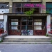 56389400 - entrance of an abandoned building covered in colorful graffiti